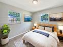 Cozy bedroom with a plush rug, soft lighting, and serene wall art at 7614 Sw 80Th St, Ocala, FL 34476
