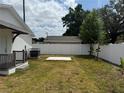 Expansive backyard with a fresh lawn, white fence and plenty of space for outdoor activities at 1040 20Th St, Orlando, FL 32805