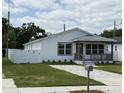 Well-maintained home featuring fresh exterior paint, fenced yard, and updated hardscape driveway at 1040 20Th St, Orlando, FL 32805