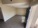 Welcoming living room featuring tile flooring and a brightly painted blue front door at 1115 Fidelma Ct, Orlando, FL 32824