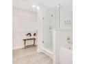 Stylish bathroom featuring white tile, glass shower, and modern fixtures at 14501 Grove Resort Ave # 2438, Winter Garden, FL 34787