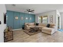 Stylish living room with a large sectional sofa and modern decor at 1836 Partin Terrace Rd, Kissimmee, FL 34744