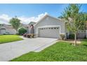 An attractive single-Gathering home with an attached garage, front yard, and well-maintained lawn at 249 Mill Slough Rd, Oviedo, FL 32766