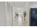 Bright hallway features tile flooring and a view to the ocean, leading to the living area and bedrooms at 3180 Ocean Shore Blvd # 407, Ormond Beach, FL 32176