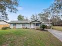 Cozy single-story home featuring stone accents and a bright, welcoming entrance at 35724 Dawn Dr, Leesburg, FL 34788