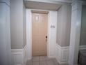 Apartment 201 entrance with neutral wall color and white trim at 4816 Cayview Ave # 20111, Orlando, FL 32819