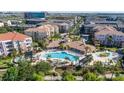 Aerial view of the community pool and recreation area with lounge chairs and play area at 4816 Cayview Ave # 20111, Orlando, FL 32819