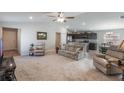 Inviting living room seamlessly connects to the kitchen, offering an open and airy layout for modern living at 490 Pentas Ln, Haines City, FL 33844