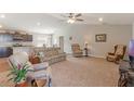 Inviting living room seamlessly connects to the kitchen, offering an open and airy layout for modern living at 490 Pentas Ln, Haines City, FL 33844