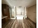 An elegant bathroom with an oversized soaking tub, glass enclosed shower, and contemporary fixtures at 56048 Blue Creek Rd, Astor, FL 32102
