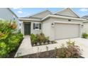 A charming home with a well-manicured lawn and a welcoming front entrance at 6834 Wilson Hammock Ave, Groveland, FL 34736