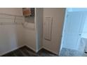 Walk-in closet featuring wire shelving for optimal storage at 7612 Danube Rd, Kissimmee, FL 34746