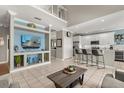 Open concept living room and kitchen, featuring modern decor and neutral finishes at 8522 Blue Horizon Ct, Kissimmee, FL 34747