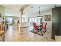 Open-concept living room featuring abundant natural light and a modern dining area at 17567 Se 81St Parnassus Ct, The Villages, FL 32162