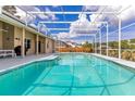 Relaxing screened-in pool and patio area perfect for outdoor enjoyment at 1837 Sweetwater West Cir, Apopka, FL 32712