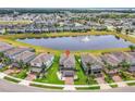 Stunning aerial view of the property with scenic pond and fountain in a well-planned community at 3961 Crawley Down Loop, Sanford, FL 32773