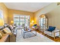 Comfortable living room featuring a plush rug and bright natural light at 4218 Inwood Landing Dr, Orlando, FL 32812