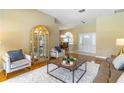 Open-concept living space with hardwood floors and stylish furnishings at 4218 Inwood Landing Dr, Orlando, FL 32812