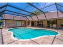 Inviting screened-in pool area perfect for relaxation and entertaining at 4218 Inwood Landing Dr, Orlando, FL 32812
