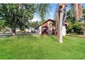 View of the front of a single Gathering home showcasing the lawn and exterior walls at 4265 Old Colony Rd, Mulberry, FL 33860