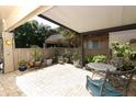 A brick-paved patio filled with potted plants, providing a serene and private outdoor space at 474 Windmeadows St # 0, Altamonte Springs, FL 32701