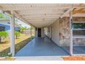 Attached carport offering covered parking and direct access to the home's entrance at 4827 Elese St, Orlando, FL 32811
