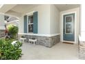 Charming front entrance with decorative door and stone accents. Perfect for welcoming guests at 5089 Meadow Song Dr, Okahumpka, FL 34762