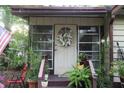 Charming front entrance with decorative wreath and greenery, creating a welcoming feel at 518 W Plantation Blvd, Lake Mary, FL 32746