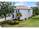 An eye-level exterior view shows a two-story home with an attached garage and mature landscaping at 520 Stonewall Ave, Haines City, FL 33844