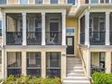 Close-up of a townhome screened porch with comfortable seating, offering a cozy outdoor living space at 1027 Cedar Bay Ln, Winter Springs, FL 32708
