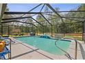 Inviting screened-in pool area, perfect for relaxation and outdoor enjoyment at 13780 Sw 78Th Pl, Dunnellon, FL 34432