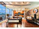 Stylish living room with hardwood floors, modern furniture, and decorative wood paneling at 155 S Court Ave # 1608, Orlando, FL 32801