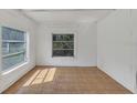 A bright living room with multiple windows and unique tile flooring at 2045 South St, Oviedo, FL 32765