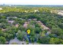 Overhead shot of a neighborhood boasting mature trees and green landscaping and showing the property location at 209 Sweet Gum Way, Longwood, FL 32779