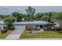An aerial view showcases this well-maintained home with a lush front yard and attached garage at 2171 Chippewa Trl, Maitland, FL 32751