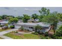 An aerial shot features this charming home with mature trees, and landscaped front yard at 2171 Chippewa Trl, Maitland, FL 32751