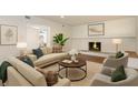 Bright living room featuring a fireplace, neutral furniture, and hardwood flooring at 2171 Chippewa Trl, Maitland, FL 32751