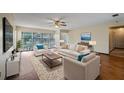 Inviting living room with large windows, ceiling fan and comfortable furniture at 2316 Irlo Dr, Kissimmee, FL 34741