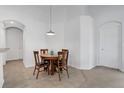 Cozy dining area with a round table and seating for four, adjacent to the kitchen at 2541 Bobby Lee Ln, St Cloud, FL 34772