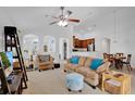 Bright living room featuring neutral tones, comfortable seating, and open-concept design at 2541 Bobby Lee Ln, St Cloud, FL 34772