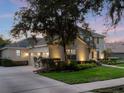 Spacious home with a three-car garage, landscaped yard, and basketball hoop at 3352 Park Grove Ct, Longwood, FL 32779