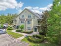 Two-story condo building with a parking area, landscaped grounds, private entrances, and stairs at 3721 S Lake Orlando Pkwy # 05, Orlando, FL 32808