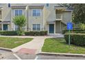 Condominium entrance and accessible parking with lush landscaping including bushes and grass at 3721 S Lake Orlando Pkwy # 05, Orlando, FL 32808