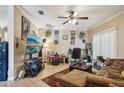 Inviting living room featuring tile floors, ceiling fan, and neutral color scheme at 3721 S Lake Orlando Pkwy # 05, Orlando, FL 32808