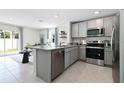 Open kitchen featuring stainless steel appliances and an island at 548 Zinfandel Dr, Daytona Beach, FL 32117