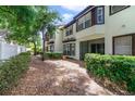 A leafy backyard space with trees offering shade in this well-maintained townhome community at 8414 Frescada Ct, Orlando, FL 32836