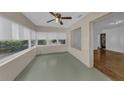 Bright sun room with large windows offering plenty of natural light and pleasant outdoor views at 849 Driver Ave, Winter Park, FL 32789