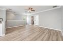 Spacious living room featuring wood floors, neutral decor, and lots of natural light at 124 Mcleods Way, Winter Springs, FL 32708