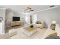 Bright living room with wood floors, modern furniture, and soft, neutral decor at 124 Mcleods Way, Winter Springs, FL 32708