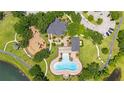 This aerial view highlights a community recreational area with a pool, playground, and green spaces at 12917 Grovehurst Ave, Winter Garden, FL 34787